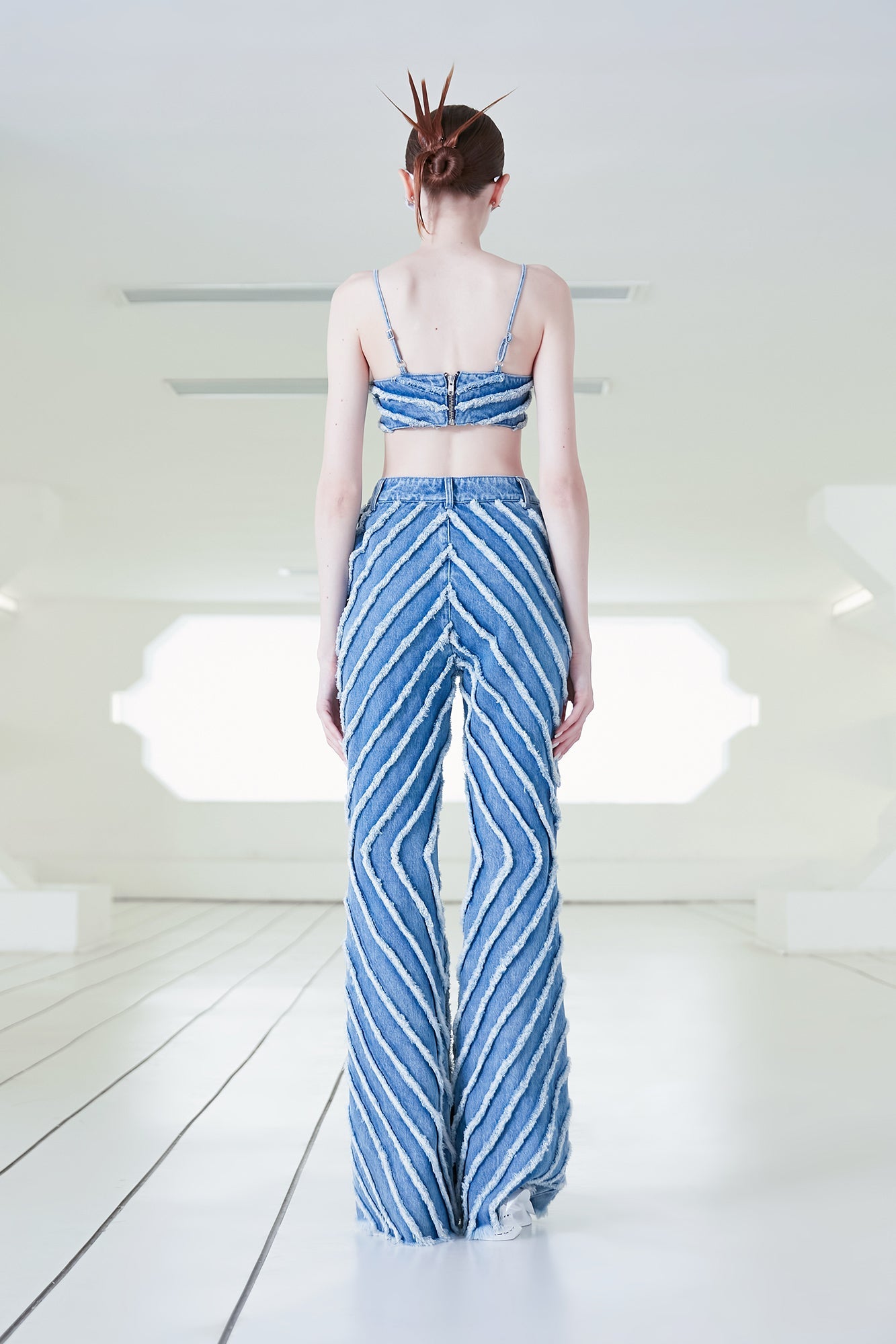 Rough-edged denim flared trousers